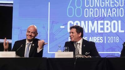 FIFA President Gianni Infantino, left, talks with Alejandro Dominguez, president of the South American Football Confederation, CONMEBOL, which has asked FIF to expand the World Cup to 48 teams for the tournament in Qatar. (AP Photo/Martin Ruggiero)