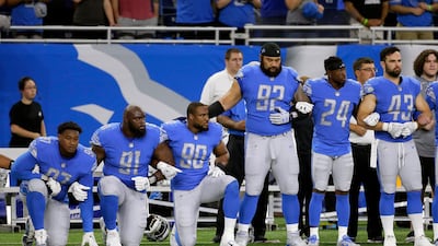 Detroit Lions defensive end Armonty Bryant (97), defensive tackle A'Shawn Robinson (91) and defensive end Cornelius Washington (90) take a knee during the national anthem before an NFL football game against the Atlanta Falcons, Sunday, Sept. 24, 2017, in Detroit. (AP Photo/Duane Burleson)