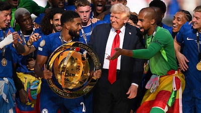 Chelsea captain Reece James lifts the Fifa Club World Cup trophy alongside teammates and US President Donald Trump. AFP