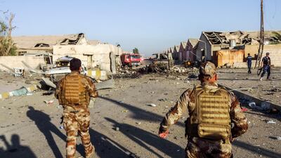 Iraq Counter-Terrorism Service (CTS) officers at the scene of a car bomb outside warehouses where ballots from the May 12 parliamentary vote were stored in Kirkuk, on July 1, 2018. Marwan Ibrahim / AFP