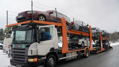 A trailer loaded with vehicles being sent to Ukraine from Latvia. Reuters
