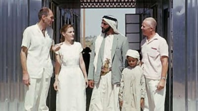 Sheikh Zayed, with his son Sheikh Sultan, speaks with staff at the new facility in 1964.