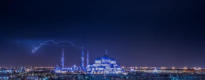 In this photo by Salem Sarhan, lightning flashes above the Sheikh Zayed Grand Mosque in Abu Dhabi