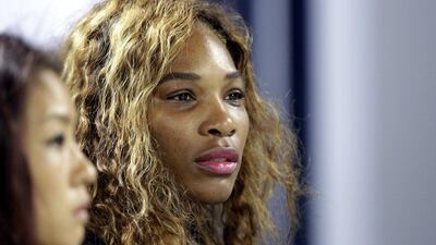 Serena Williams watches her sister Venus play on Monday. Kamran Jebreili / AP