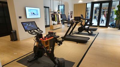 A Peloton showroom displays bikes and treadmills. The company's shares tumbled on Thursday, January 20, after a media report said the exercise and treadmill company was temporarily halting production of its connected fitness products amid waning consumer demand. Getty Images / AFP