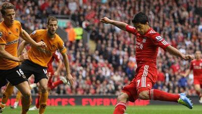Luis Suarez, right, puts Liverpool 2-0 ahead against Wolves.