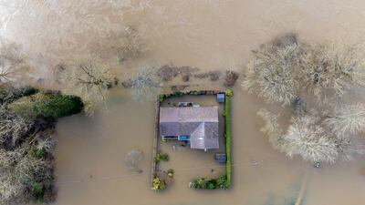 An aerial view of a property surrounded by floodwater after the River Severn burst its banks on Tuesday, at Bewdley in Worcestershire, in the aftermath of Storm Franklin. PA