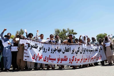Afghans shout slogans during a protest against the death of three Afghan refugees in a car blaze in Iran, outside the Iranian consulate in Kandahar, Afghanistan, 14 June 2020. EPA