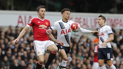 Tottenham's Dele Alli, right, and Manchester United's Michael Carrick in action during their Premier League match at White Hart Lane on Sunday. Tottenham won 3-0. Reuters / Eddie Keogh