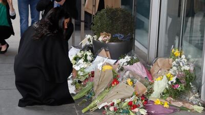 Meghan, Duchess of Sussex, lays a floral tribute at New Zealand House in London . AP