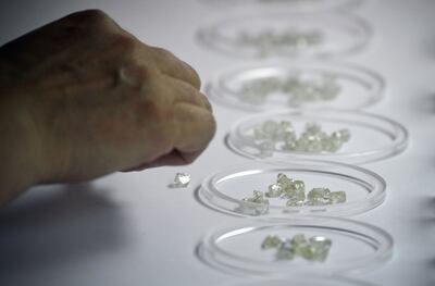 Rough diamonds at the Alrosa diamond sorting centre in the town of Mirny, in Siberia, Russia. AFP