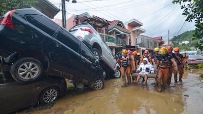 A resident is carried to safety in Cebu city. AFP