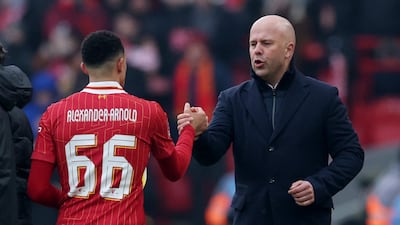 Liverpool's Trent Alexander-Arnold shakes hands with manager Arne Slot. Reuters