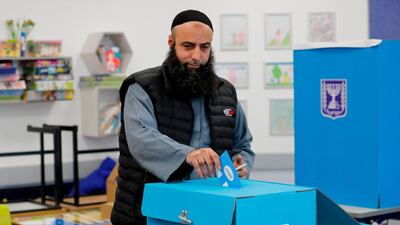 A Muslim Arab Israeli casts his vote in the country's parliamentary elections at a polling station in the Arab city of Tamra in northern Israel on March 2, 2020. AFP