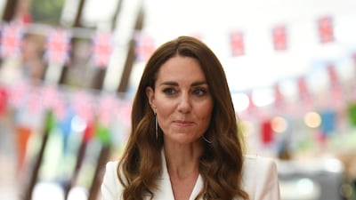 The Duchess of Cambridge in a crisp white, semi-fitted Alexander McQueen coat dress for a royal reception at the G7 Summit in Cornwall on Friday, June 11. Reuters