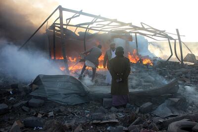 Yemenis inspect the damage at the site of air strikes in the Houthi-held city of Saada, north-west Yemen. AFP