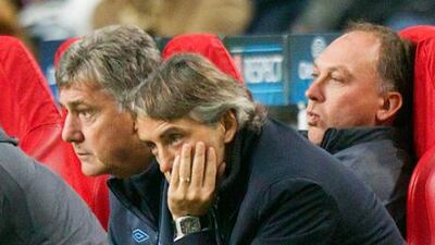 Manchester City manager Roberto Mancini watches his side's defeat to Ajax.