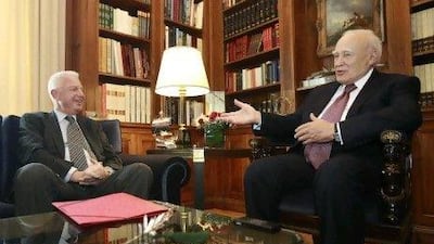 Panagiotis Pikrammenos, left, has been appointed Greece's caretaker prime minister by the Greeh President Karolos Papoulias, right.