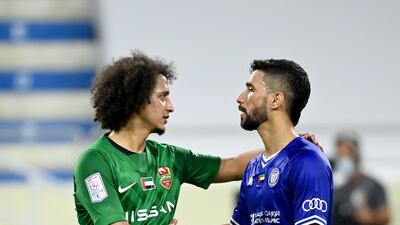 Omar Abdulrahman shakes hands with an Al Nasr player at the end of the match.