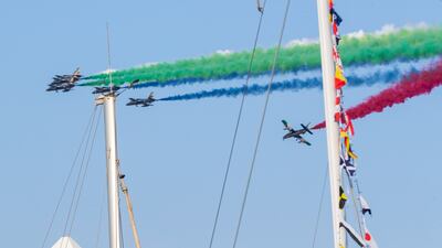 The UAE's Al Fursan aerobatics team provide soaring entertainment before the qualifying session at the Abu Dhabi Grand Prix. Victor Besa / The National