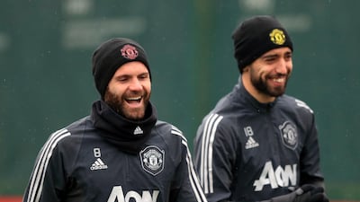 Manchester United's Juan Mata, left, and Bruno Fernandes during training on Wednesday ahead of their Europa League match at Club Brugge. AP