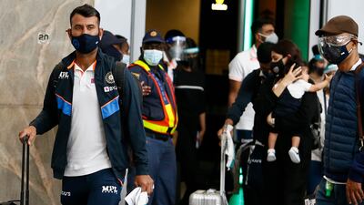 Cheteshwar Pujara arrives with his India teammates in Johannesburg. AP