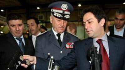 The interior minister, Ziad Baroud, right, and Gen Ashraf Rifi, centre, the police force's chief of staff, disagreed over the dismissal of a police official.