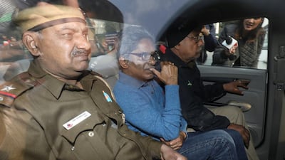 Rajiv Saxena, accused of involvement in India's scandal-tainted helicopter deal with Anglo-Italian firm Agusta Westland, is pictured inside a vehicle outside a court in New Delhi, India. Reuters