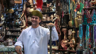 A shop owner at Muscat's famous Mutrah Souq. The introduction of personal income tax could have an impact on household budgets and spending. Victor Besa / The National
