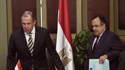 The Egyptian foreign minister Nabil Fahmy, right, and his Russian counterpart, Sergey Lavrov, arrive for a press conference in Cairo on November 14. Khaled Desouki / AFP