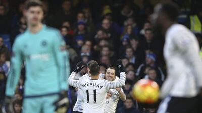 Everton’s Leighton Baines, right, celebrates with teammates after his cross was turned in for an own goal on Saturday against Chelsea. Justin Tallis / AFP