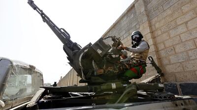 A Houthi rebel mans a heavy caliber machine gun during a gathering to mobilise more fighters in Sanaa on August 11, 2016. Yahya Arhab / EPA