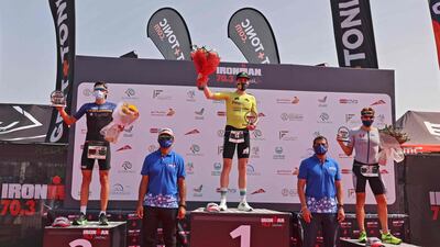 From left, Portugal's Filipe Azevedo, Daniel Bakkegard of Denmark and Sweden's Rasmus Svenningsson take the podium spots in the men's Ironman 70.3 Dubai 2021 triathlon. AFP