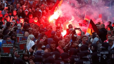 Right wing demonstrators light flares during protests in Chemnitz in 2018. AFP