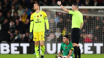 Newcastle United's Miguel Almiron reacts after being injured. AFP
