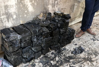 Bags of banknotes retrieved from the underground coffers of a central bank branch in the northern Iraqi city of Mosul, once a stronghold of the Islamic State(IS) group, are piled up on the floor, on October 20, 2021. AFP