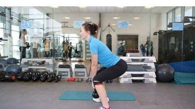 Squat slightly while ensuring you are engaging the abdominal muscles. Maintain an arch shape.