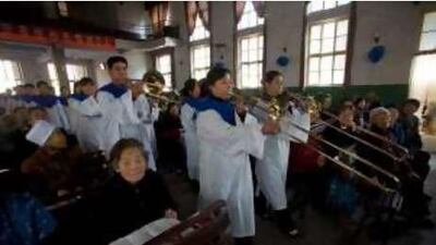 A band plays at the beginning of a Christian church service in Pu Cheng, Shanxi.