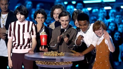 Finn Wolfhard, from left, Jack Dylan Grazer, Wyatt Oleff, Jaeden Lieberher, Jeremy Ray Taylor, Chosen Jacobs and Sophia Lillis accept the award for best on-screen team for 'It' AP