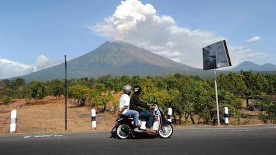 A motorcyle passes by. Sonny Tumbelaka / AFP Photo