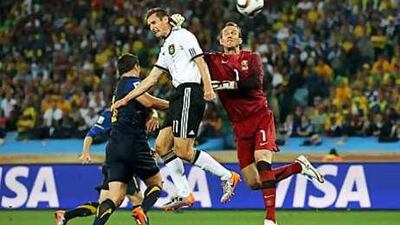 Miroslav Klose rises to head home Germany's second goal against Australia at Moses Mabidha Stadium last night.