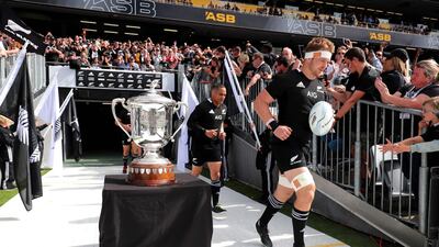 New Zealand captain Sam Cane leads his team onto the pitch for the second Bledisloe Cup match against Australia in Auckland. AFP