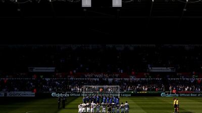 Swansea and Chelsea players observe one minute silence in remembrance of the ninety six victims of the Hillsbrough disaster prior to the English Premier League soccer match played between Swansea City AFC and Chelsea FC in Swansea, Britain, Sunday 13 April 2014. EPA/GEOFF CADDICK