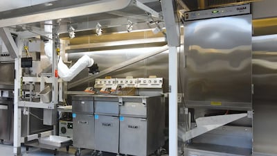 Flippy can perform several tasks, including tossing fries in a deep fat fryer and flipping burgers.