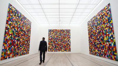 A man walks in front of the enamel on alu dibond 4900 Colors from 2007 by German artist Gerhard Richter during a media preview of the exhibition Gerhard Richter at the Fondation Beyeler in Riehen near Basel 16 May, 2014. Reuters