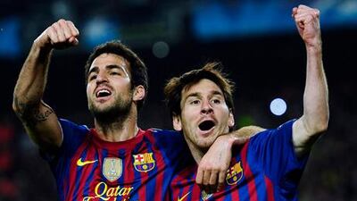 Lionel Messi, right, celebrates with Cesc Fabregas as Barcelona booked their place in the semi-finals of the Champions League for a fifth successive season.