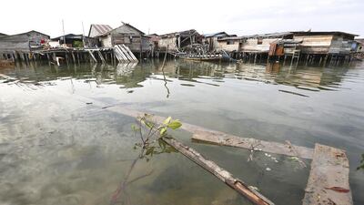 A collapsed walkway floats in the water next to Penagi, an ethnic Chinese village built on stilts, on Natuna Besar. Tim Wimborne / Reuters