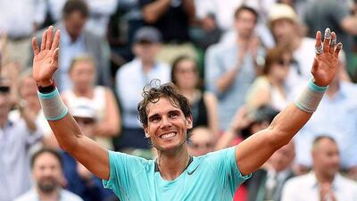 Spain's Rafael Nadal celebrates after winning a record ninth French Open final, beating Serbia's Novak Djokovic in Paris. Miguel Medina / AFP / June 8, 2014
