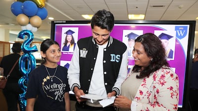 Devansh Singhi one of the boys topper celebrating with his sister and mother after getting the IB results at the GEMS Wellington Academy in Silicon Oasis in Dubai. Pawan Singh / The National