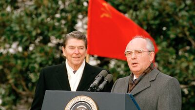 Gorbachev and Reagan speak to the press in Washington on December 8, 1987. AP